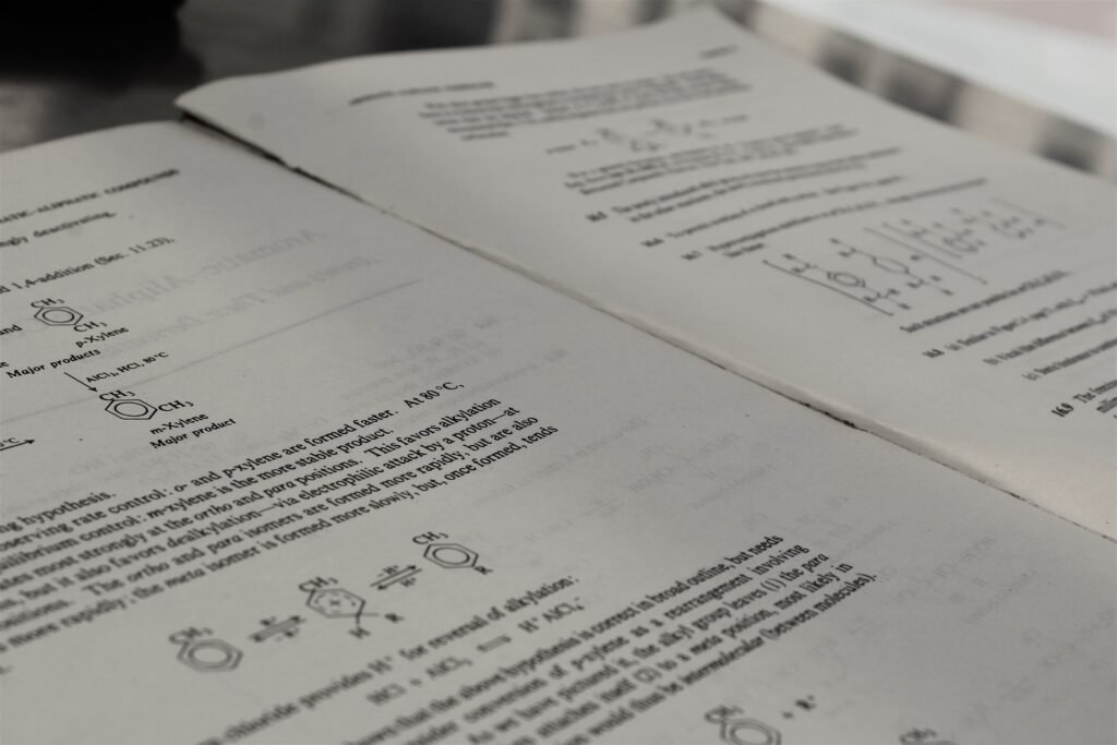 alt="Opened book with chemical formulas resembling a chemistry book"