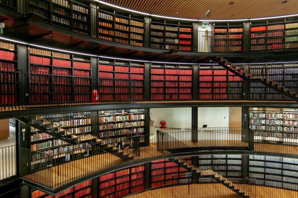 alt="four level library filled with various books"