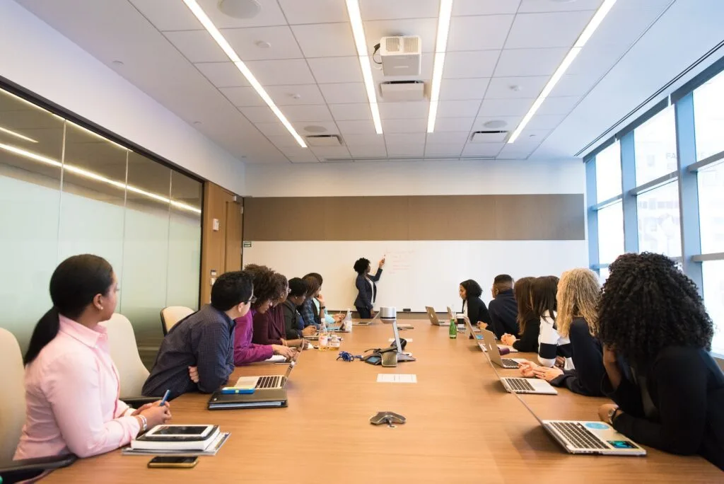 alt="A group of teachers having a professional development meeting as part of education dynamics"